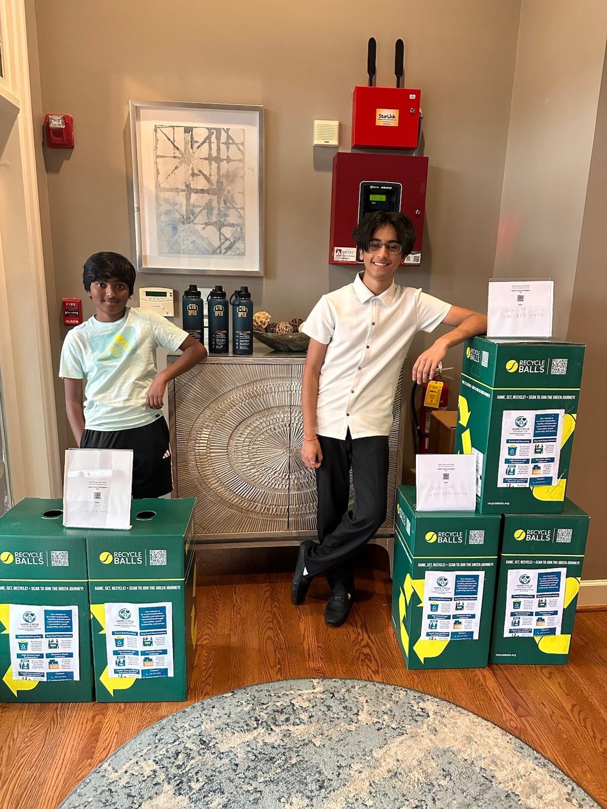 Youth setting up recycling collection station